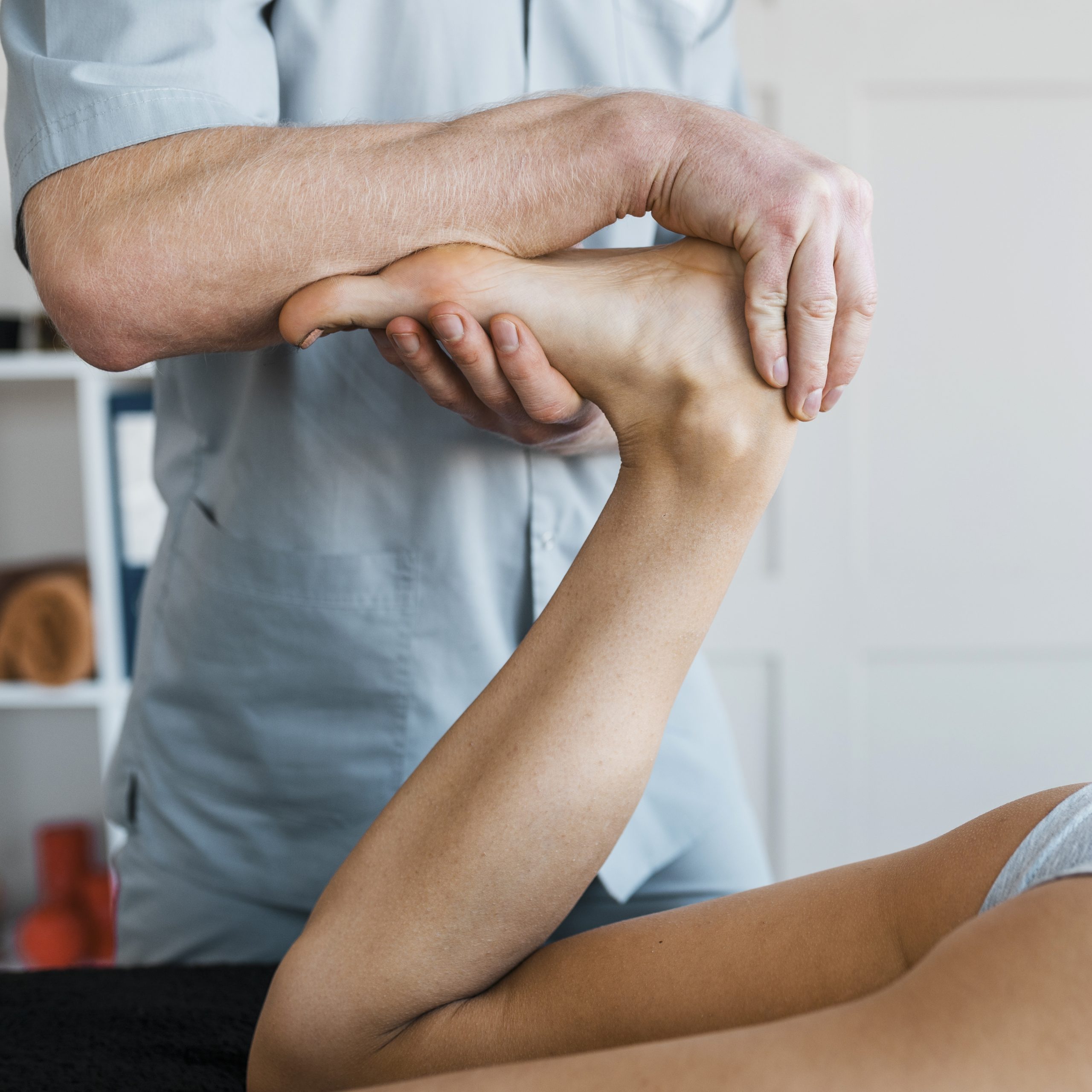 male physiotherapist female patient massage session